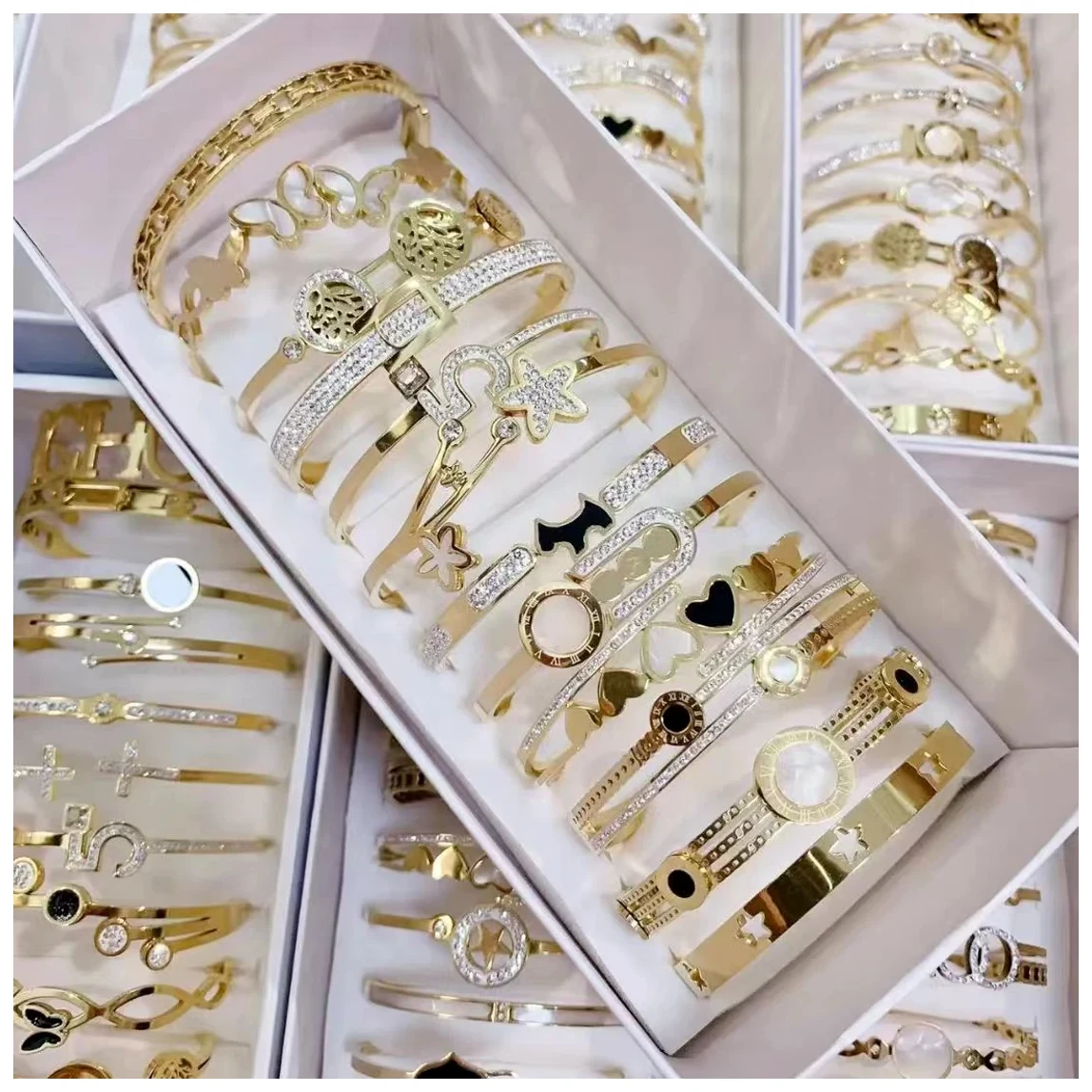 Bracelet assortments organized in multiple trays